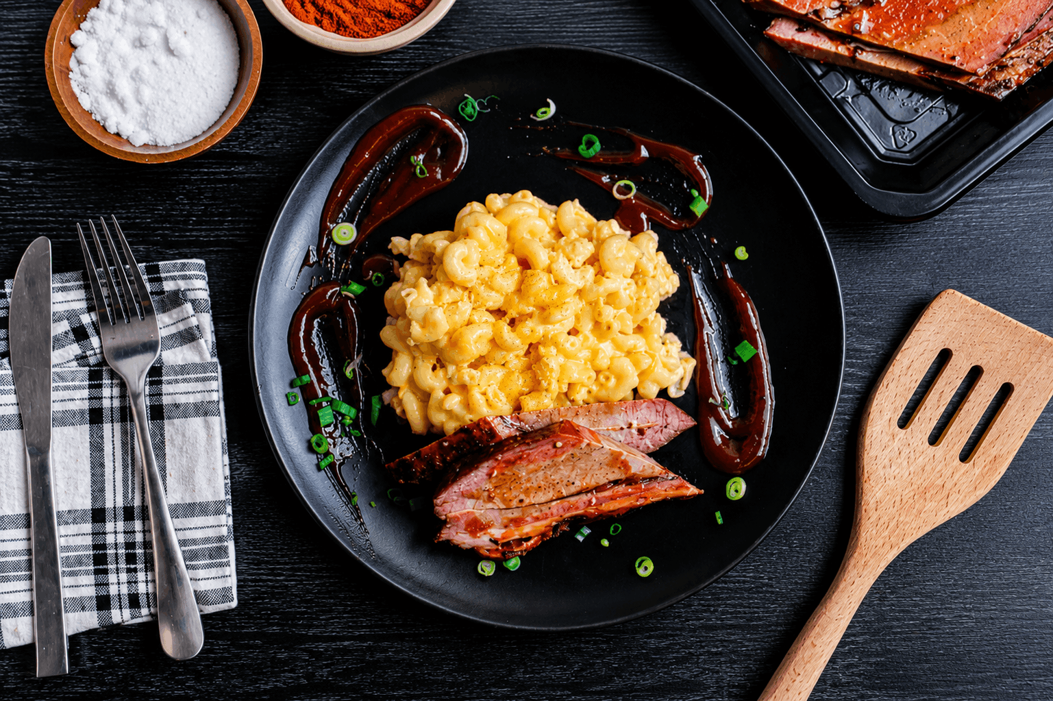 Slow-smoked Texas-style beef brisket finished with a sweet and smoky house-made BBQ glaze, paired with pasta coated in a creamy three-cheese sauce.