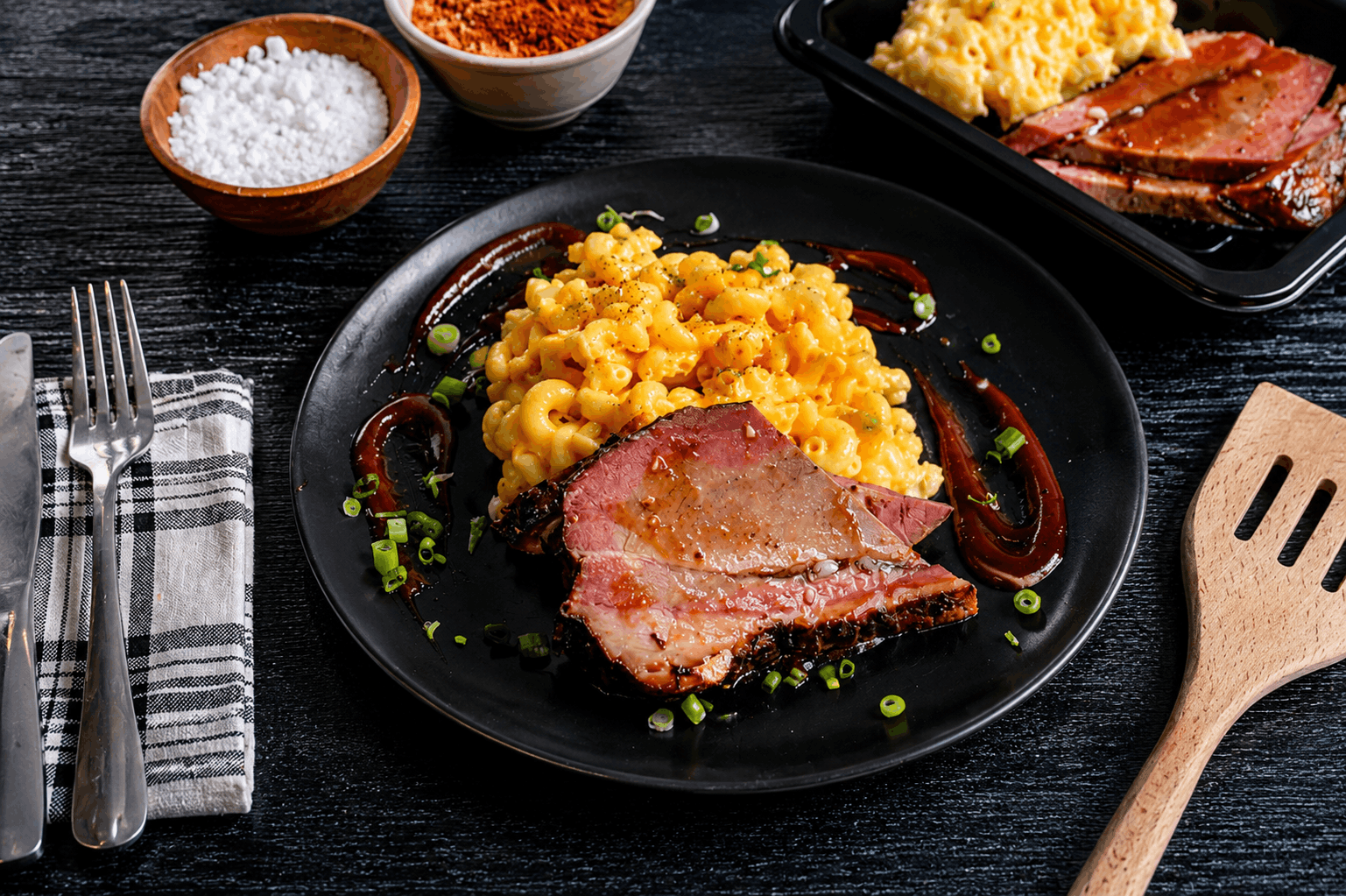 Slow-smoked Texas-style beef brisket finished with a sweet and smoky house-made BBQ glaze, paired with pasta coated in a creamy three-cheese sauce.